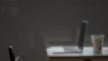 abstract blur work desk with laptop and cup of coffee, empty space, copy space photo