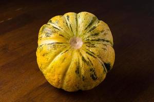 Blewah, Cantaloupe or Cucumis melo, a type of melon found in Indonesia, with a wooden background, cantaloupe is often used to make drinks during the fasting month of Ramadan photo