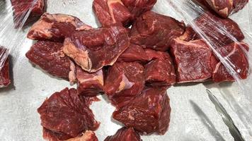 beef that is cut into pieces, looks fresh, in a container and ready to be cooked on Eid al Adha idul qurban photo