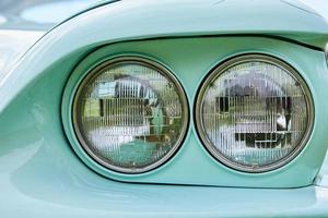 Closeup headlight of retro car photo