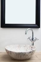 Bathroom interior with marble sink and faucet photo