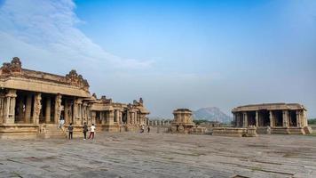 Hampi, Karnataka, India - Nov 3 2022 - Tourists at the Vijaya Vitthala Temple in Hampi which is an iconic monument photo