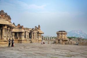 Hampi, Karnataka, India - Nov 3 2022 - Tourists at the Vijaya Vitthala Temple in Hampi which is an iconic monument photo