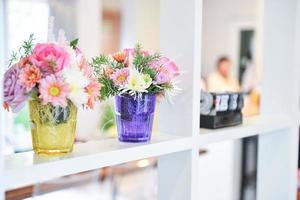 Flowers in glass glass vase photo