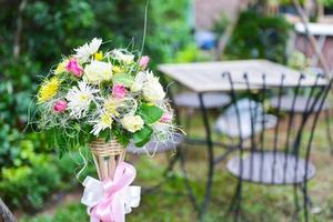 Flowers in glass wooden vase photo