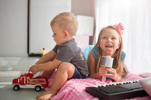 A girl in the image of a princess sings into a microphone. Karaoke at home photo