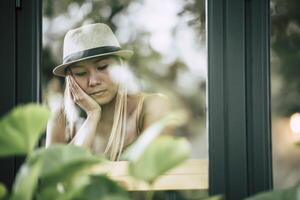 young woman sitting in a cafe photo