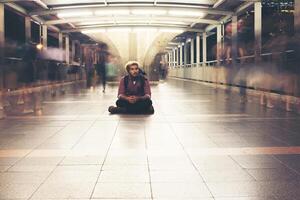 man sitting and waiting photo