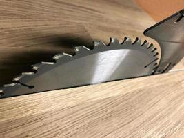 teeth of a steel circular table saw photo