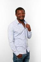 Happy african american black man with small beard in casual bright shirt isolated white background photo