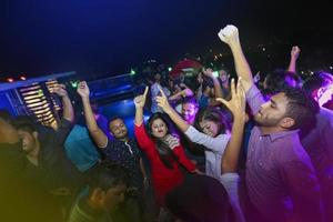Bangladesh, October 23, 2015, People dancing and enjoying DJ Party at Picasso Restaurant in Capital city of Dhaka. photo