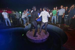 Bangladesh, October 23, 2015, People dancing and enjoying DJ Party at Picasso Restaurant in Capital city of Dhaka. photo