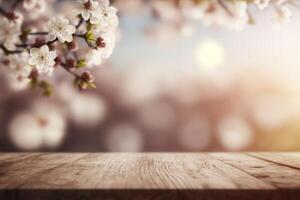 Wooden top table with spring cherry blossom and blur background. photo
