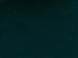 Dark green old velvet fabric texture used as background. Empty green fabric background of soft and smooth textile material. There is space for text. photo