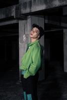 an Asian man wearing a green jacket and black beanie photo