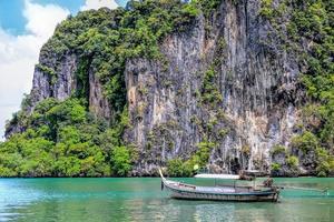 Thailand ocean landscape with traditional long tail boat photo