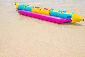 Banana boat on beach photo