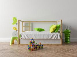 Empty children's room with a wooden cot and a white wall in the background. On the floor, toys, stylized hanger and a small toy robot. photo