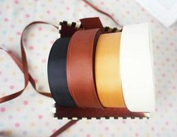 Colorful ribbons of different colors and sizes in a shop window photo