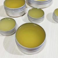 jars of homemade balm on white background photo