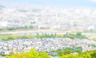 blur image of cityscape with bokeh in miniature effect for background usage. photo