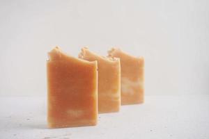 Handmade soap bars on a white background. Selective focus. photo