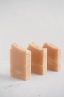Handmade soap bars on a white background. Selective focus. photo