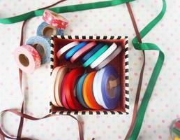 a few rolls of colorful ribbon for crafting, handmade items and DIY photo