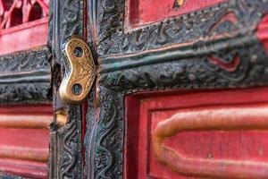 Golden key at the door of Hall of Preserving Harmony in Forbidden City, Beijing, China photo