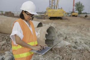 Civil engineers working at a construction site,The company manager supervises the road construction. photo