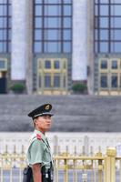 BEIJING, CHINA - JUNE 27, 2016-Chinese soldier marching in Tiananmen square with the Chinese Parliament in background. Tiananmen square is the third largest square in the world and important site. photo