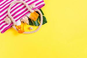 Summer bag background with copy space. Flat lay photo on color table, travel concept. Free space for text, mock-up