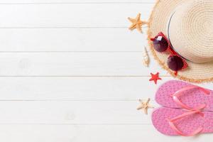 Travel and vacation accessories on a white wooden background. top view summer holiday concept with copy space photo