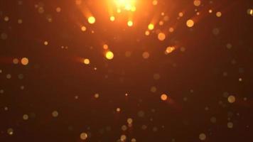 Abstract background of yellow orange gold glowing particles and bokeh dots of festive energy magic, video 4k, 60 fps