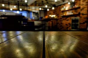 Close up Surface of Wooden Table in Cafe with Bokeh Background. photo