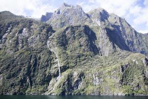 Fiordland National Park Steep Mountain With A Waterfall photo