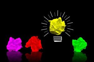 Colorful Paperballs Light Bulbs on Black Background - Idea, Creativity Concept photo