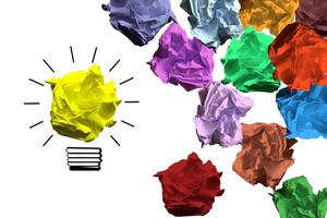 Light Bulb Icon and Colorful Crumpled Papers - Idea, Creativity Concept photo