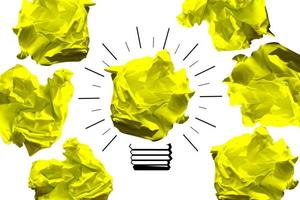 Light Bulb Icon Made with Crumpled Paper - Idea, Creativity Concept photo