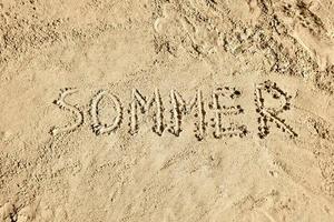 Summer in German - Word on Sand photo