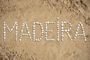 Madeira - Word Made with Stones on Sand photo