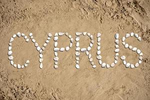 Cyprus - Word Made with Stones on Sand photo