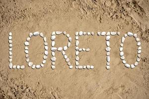 Loreto - Word Made with Stones on Sand photo