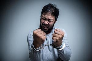 Asian handsome man angry on white background,Portrait of young Stress male concept,Bad mood after talking on the phone photo