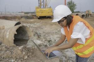 Civil engineers working at a construction site,The company manager supervises the road construction. photo