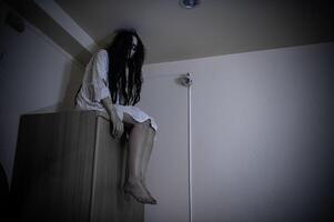 Portrait of asian woman make up ghost,Scary horror scene for background,Halloween festival concept,Ghost movies poster,angry spirit in the apartment photo