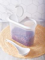 Organization of food storage in the kitchen, transparent reusable jars for cereals, coffee, sugar and pasta photo