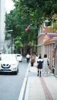 Guangzhou City, China, 2022 - The city street view with the travelling people in the city in summer photo