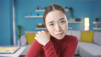 Paranoid Asian young woman looking at camera. Young Asian paranoid woman looking at camera with fearful eyes. video