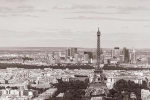 Eiffel Tower against La Defense district in sepia photo